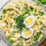 Deviled egg pasta salad with macaroni and creamy dressing.
