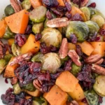 Tray of roasted butternut squash with crispy edges and a golden finish, ideal for meal prep.
