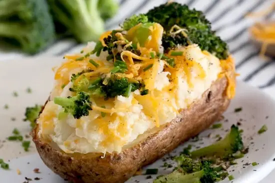 Twice-baked potatoes with broccoli and melted cheese.