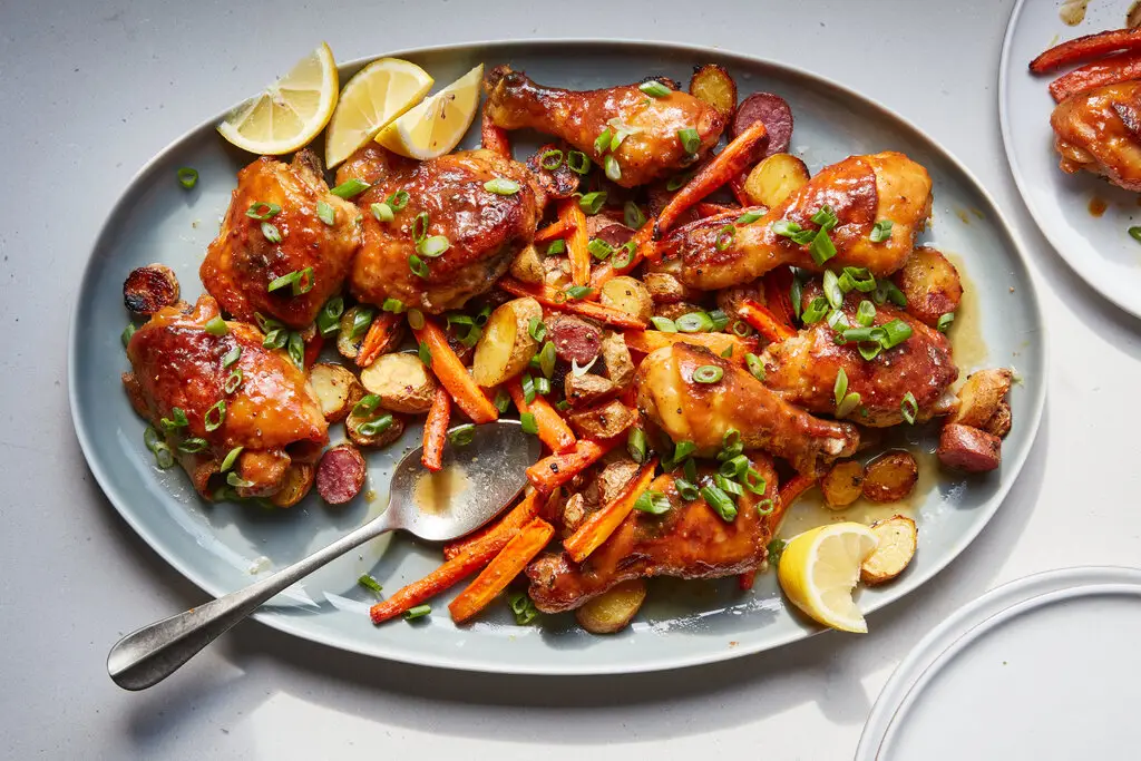 Golden honey mustard roasted potatoes served on a plate, crispy and caramelized with a sweet and tangy glaze.