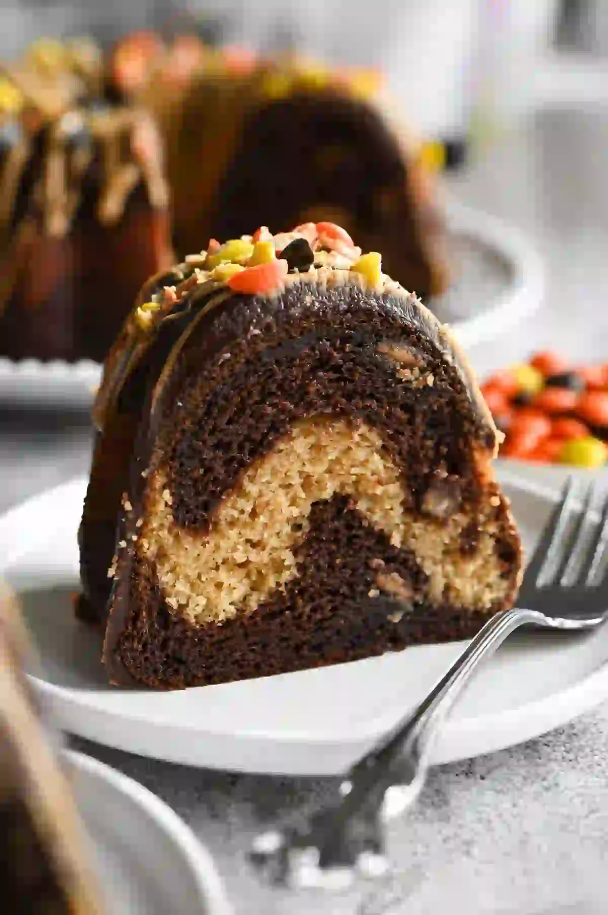 Chocolate peanut butter Bundt cake topped with creamy peanut butter and chocolate glaze.
