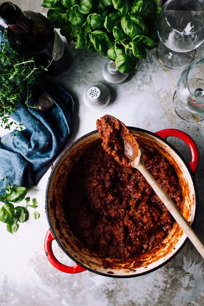 Bolognese meat sauce simmering in a pot