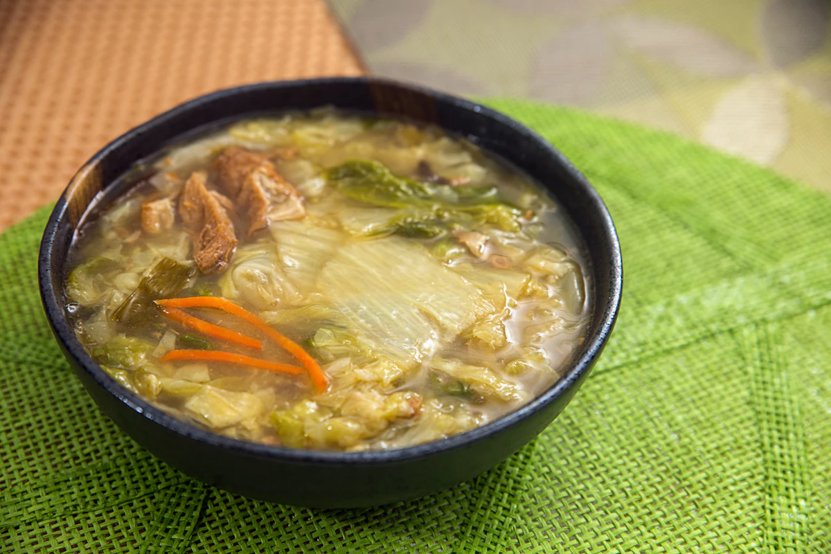 Bowl of cabbage soup for weight loss with vegetables in a savory tomato broth