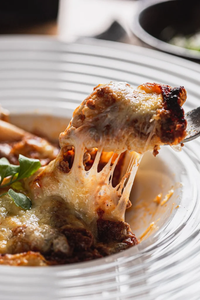Cheesy stuffed pasta with melted mozzarella
