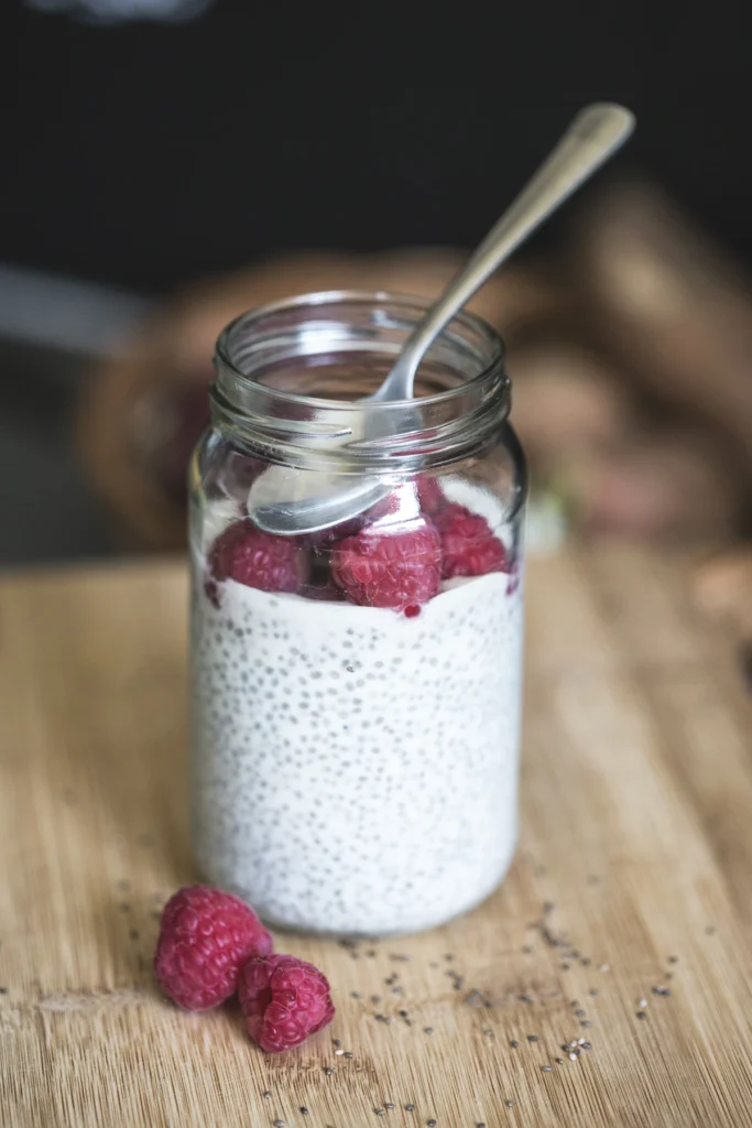 Chia pudding in a jar topped with raspberries