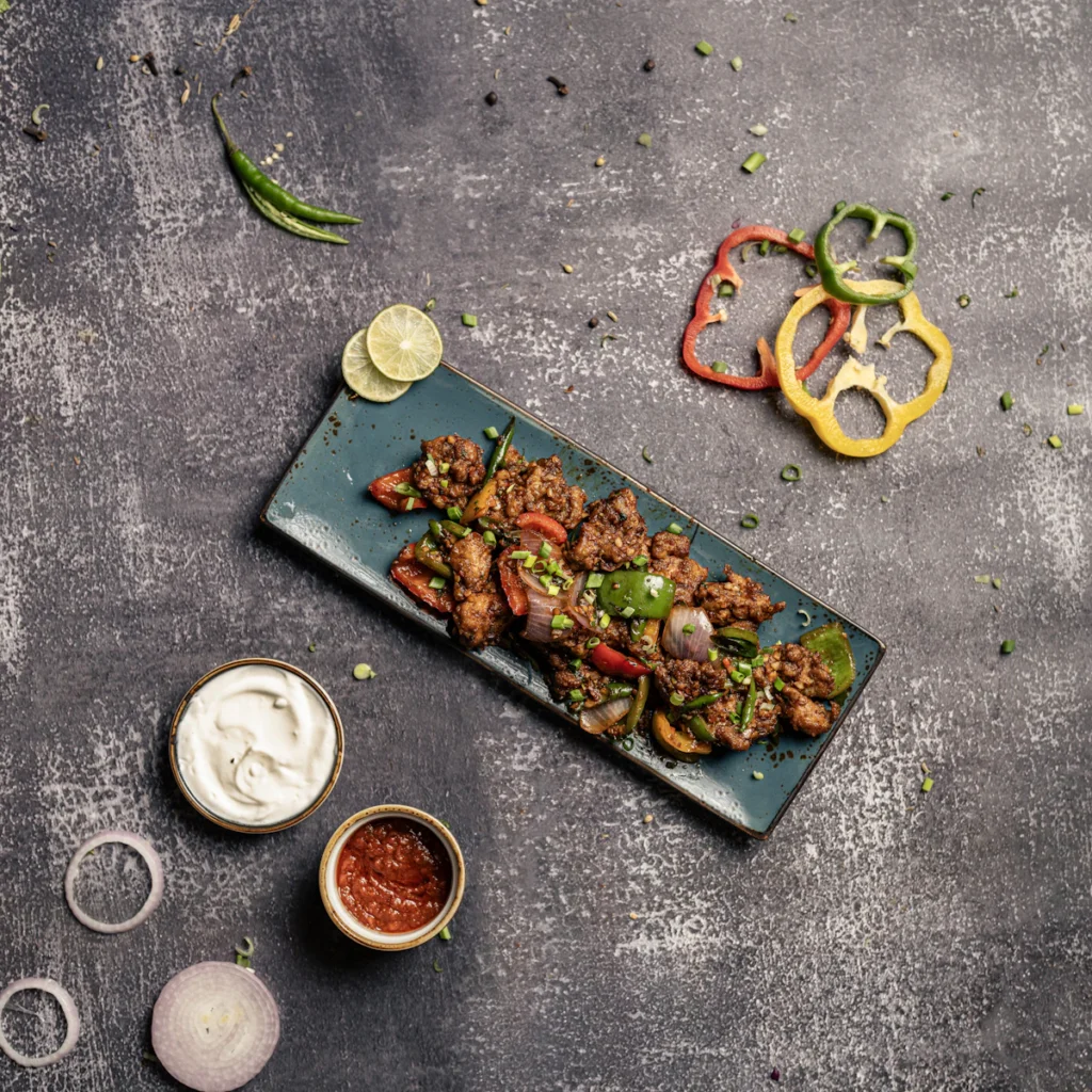 Grilled chicken bites plated with sides