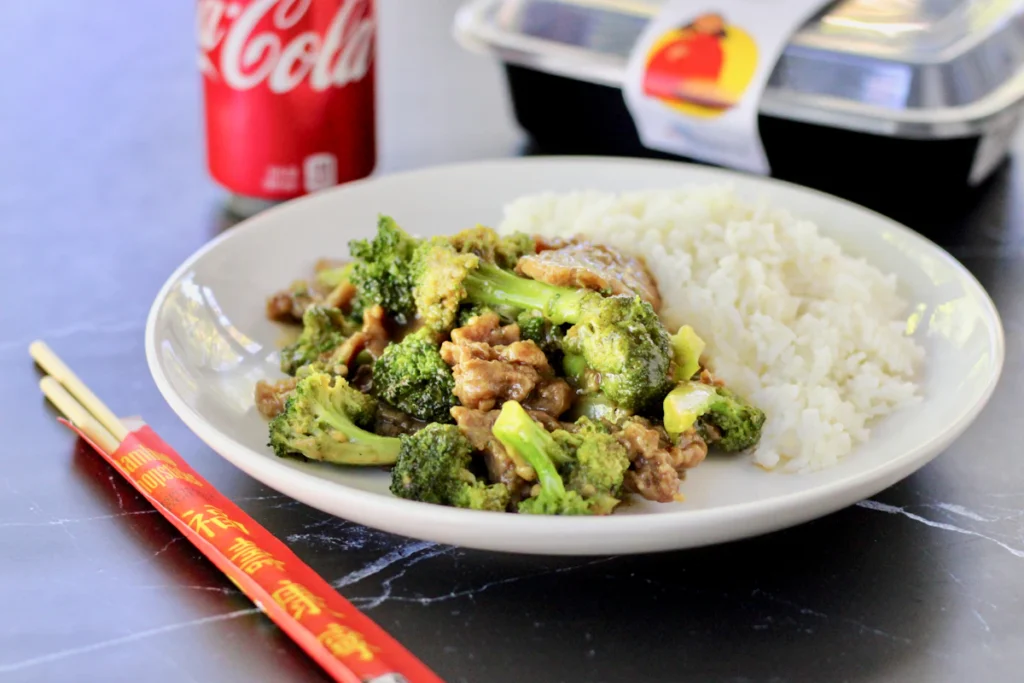 Chicken and broccoli served with rice