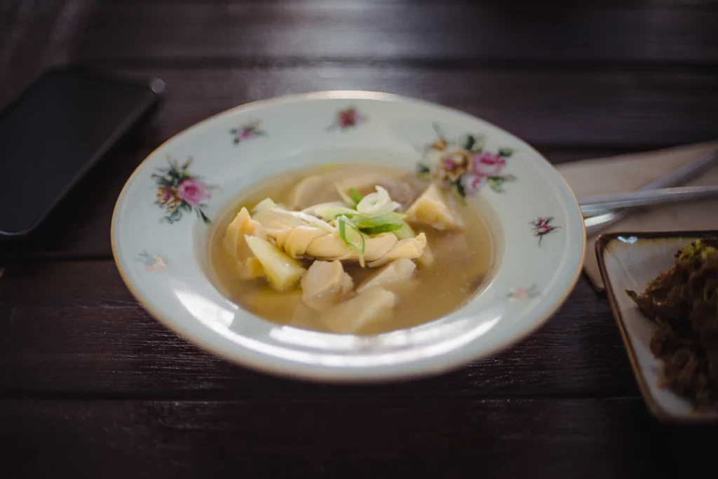 Chicken and dumplings served in a white bowl
