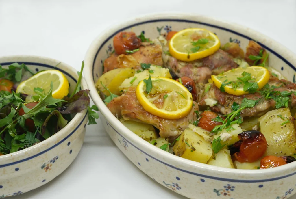 Chicken baked with lemon and herbs in a dish