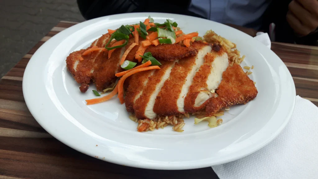 Chicken Parmesan with marinara and melted cheese
