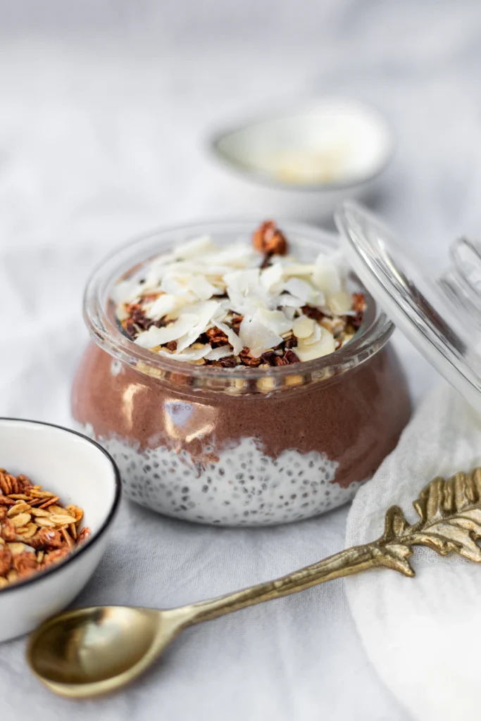 Chocolate chia pudding in a jar with coconut topping