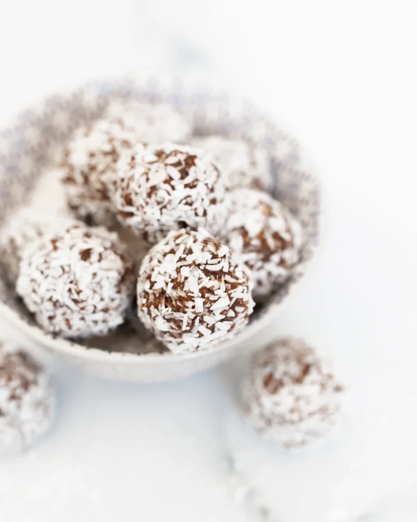 Bowl of chocolate energy balls on a table
