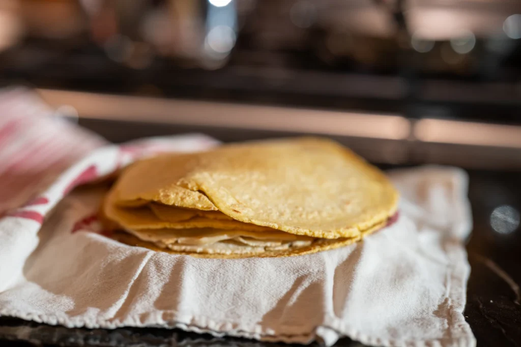 Stack of corn tortillas for green chile chicken enchilada casserole