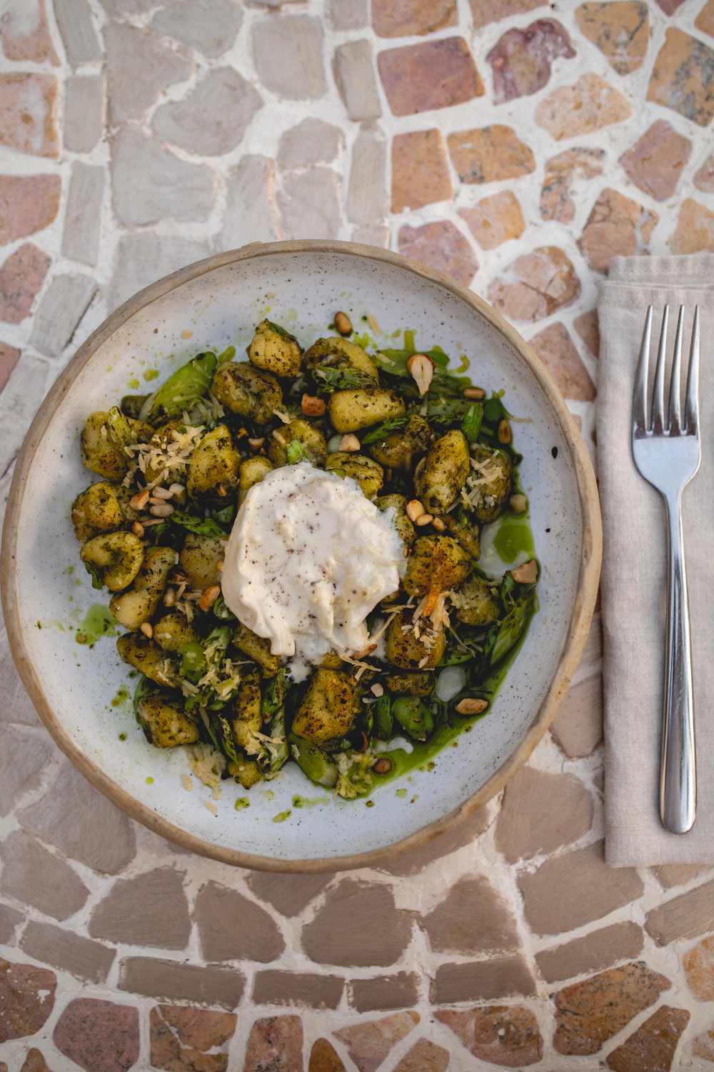 Creamy pesto gnocchi in a bowl