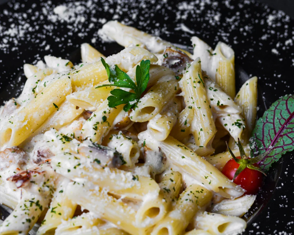 Creamy tube pasta tossed in sauce