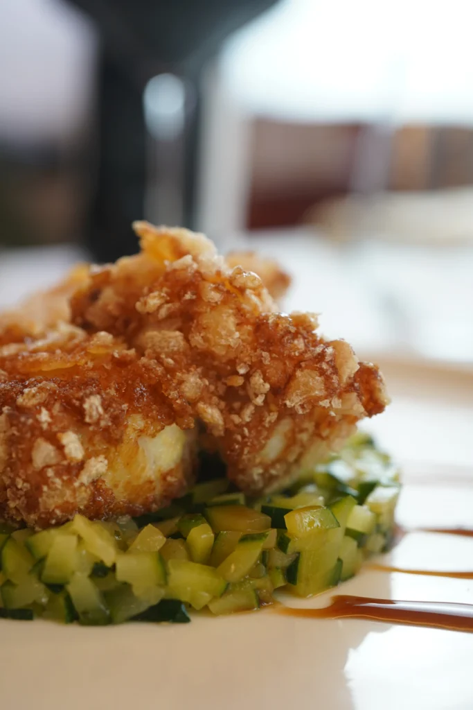 Golden crispy breaded chicken fresh from the pan