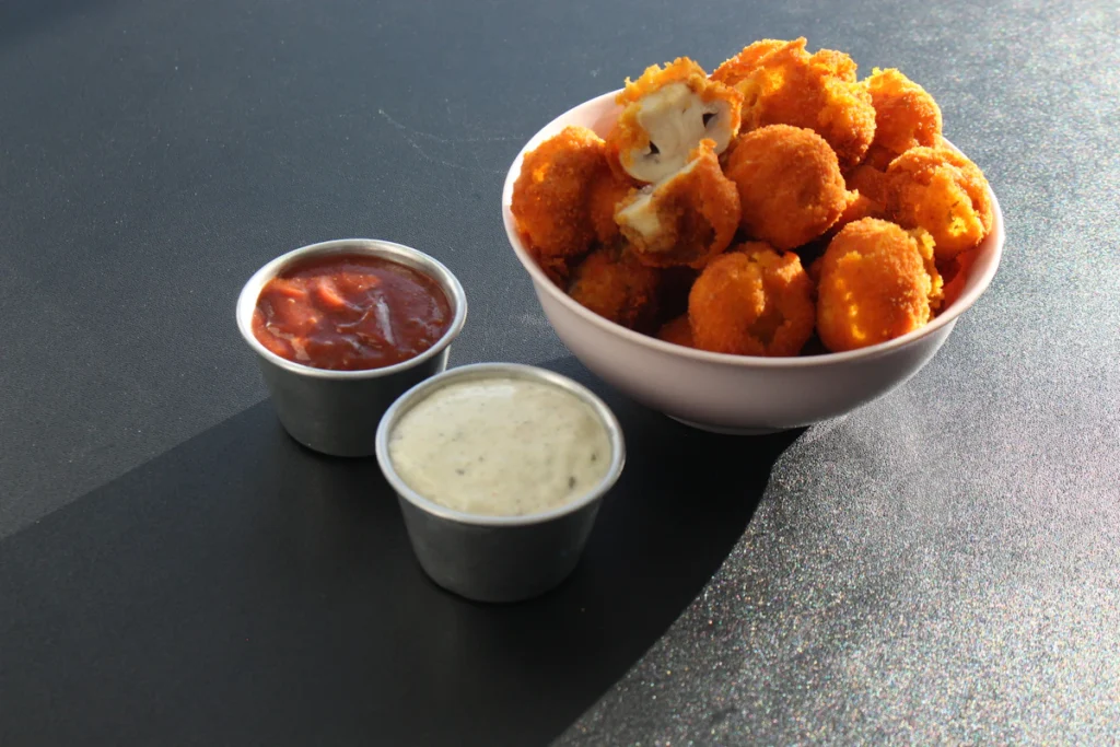 Crispy chicken bites with dipping sauces