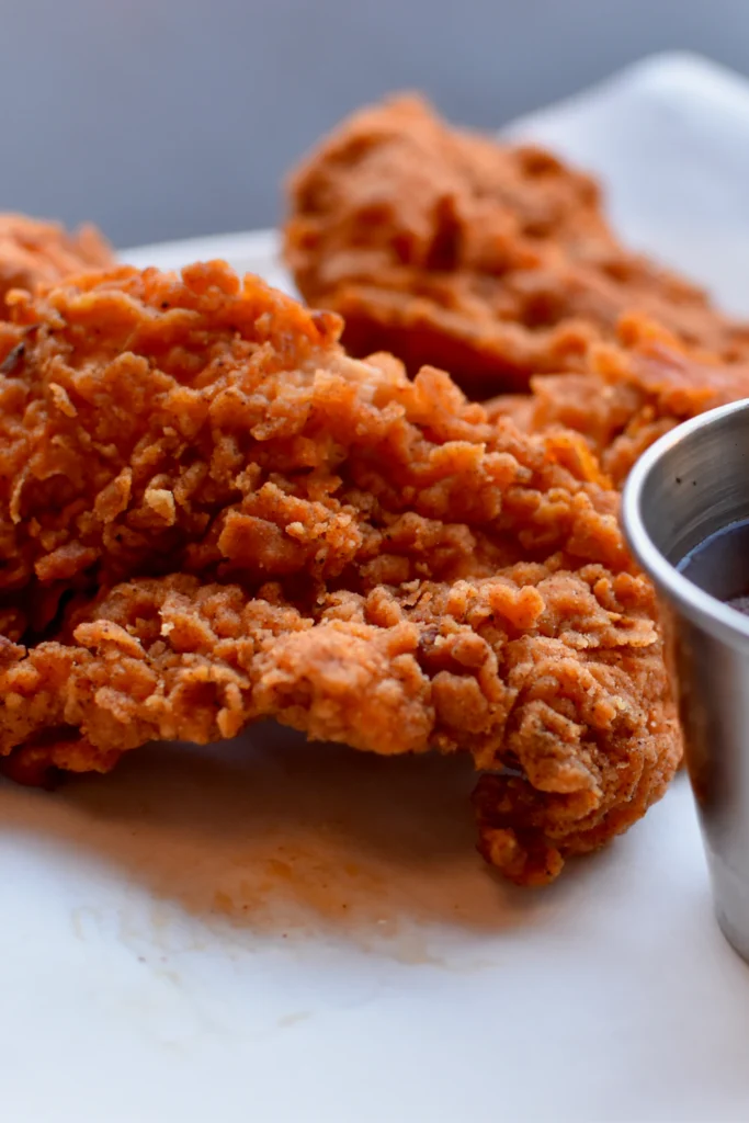 Crispy golden chicken tenders with dipping sauce