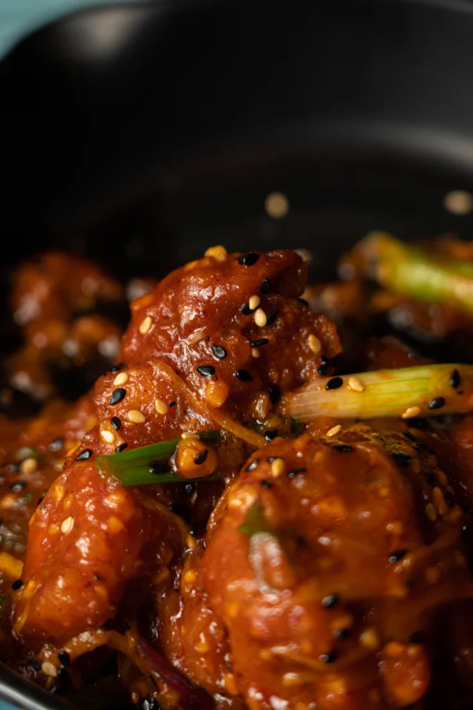 Crispy fried chicken in sticky sauce