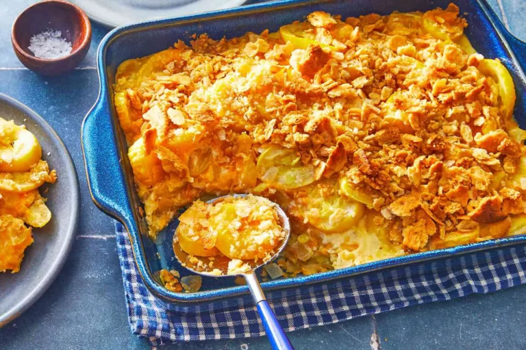 Southern squash casserole with golden Ritz cracker topping in a baking dish