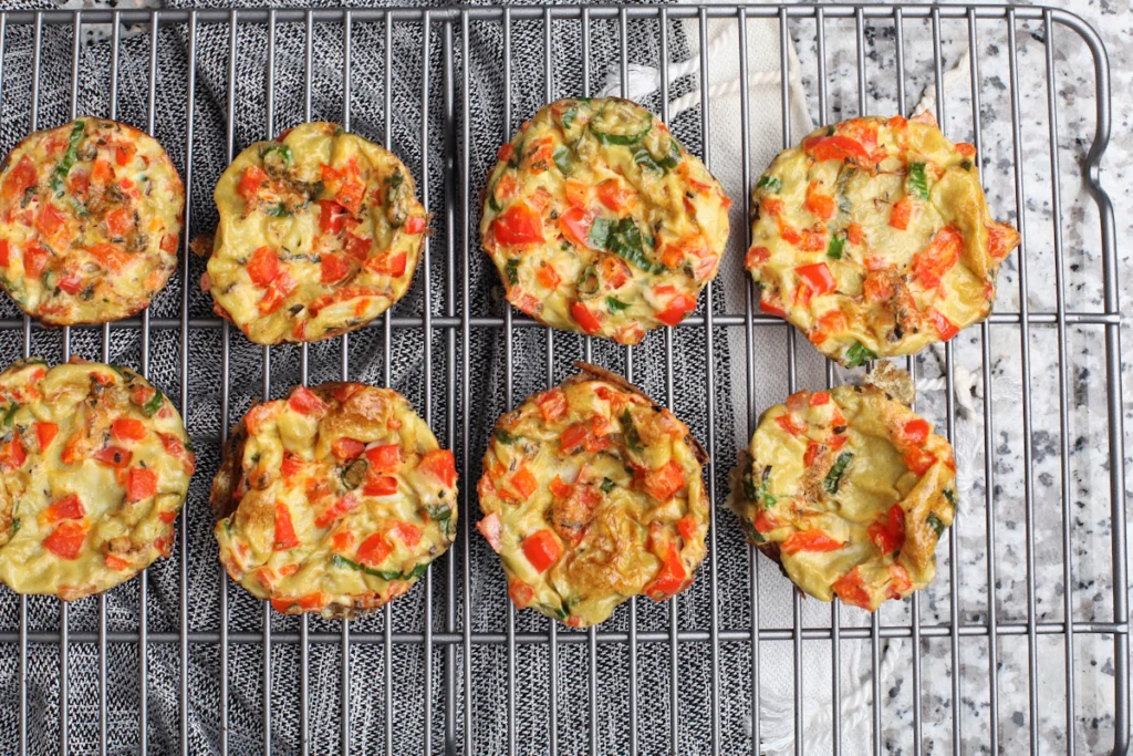 Baked egg bites cooling on a wire rack