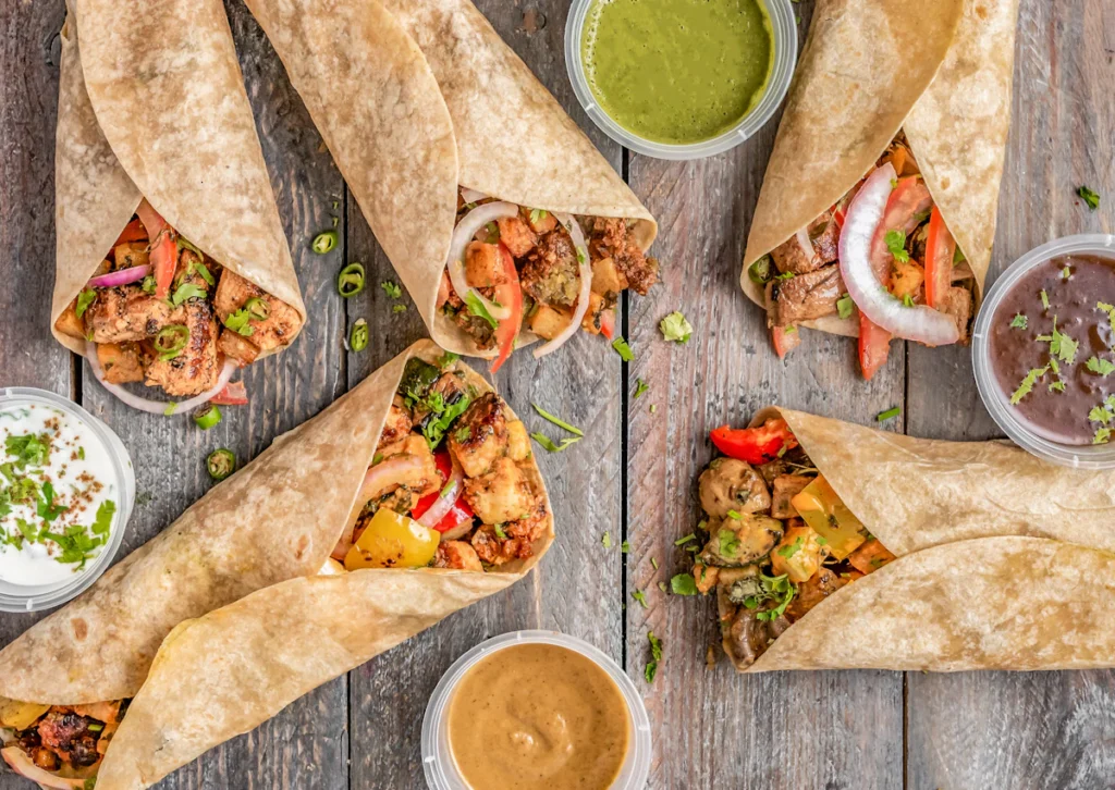 Folded chicken burritos ready to toast