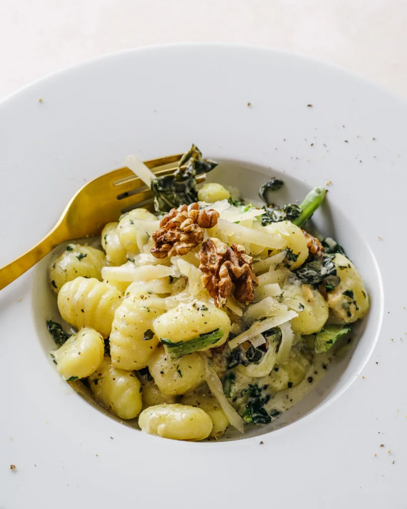Gnocchi coated in a creamy pesto sauce