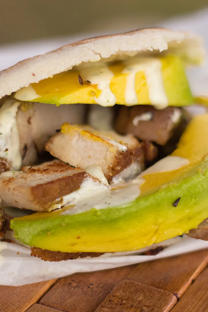 Greek chicken gyro wrapped in warm pita