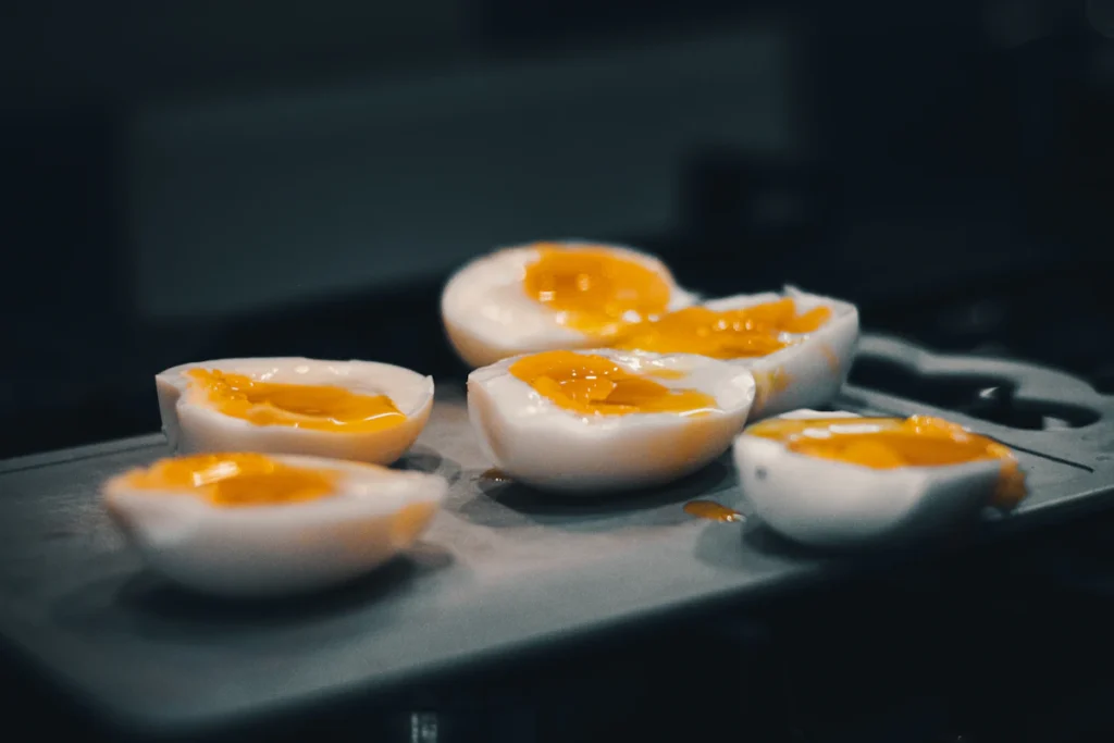 Halved hard boiled eggs for deviled egg pasta salad