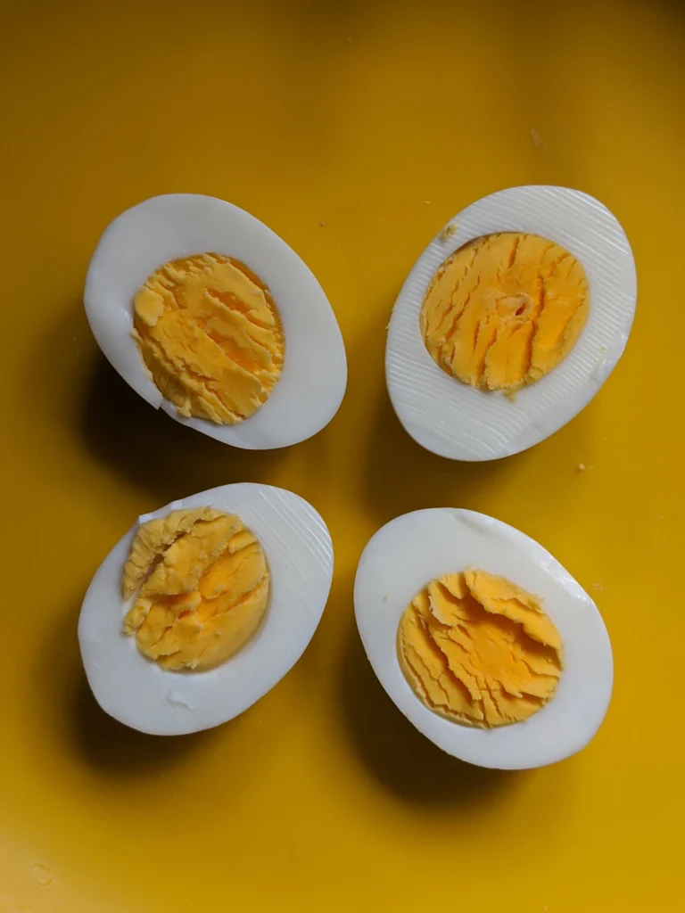 Halved hard-boiled eggs with bright yellow yolks