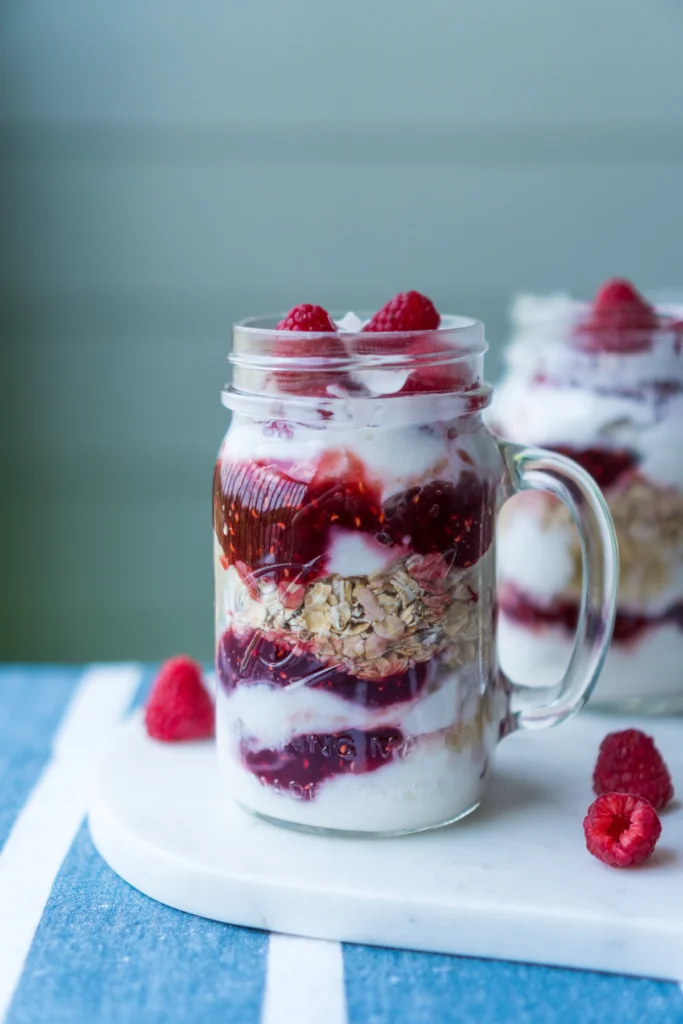 High protein overnight oats layered in jars with fresh berries
