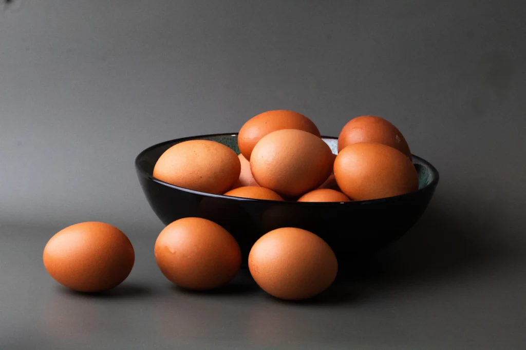 Bowl of large brown eggs used to bind cottage cheese flatbread