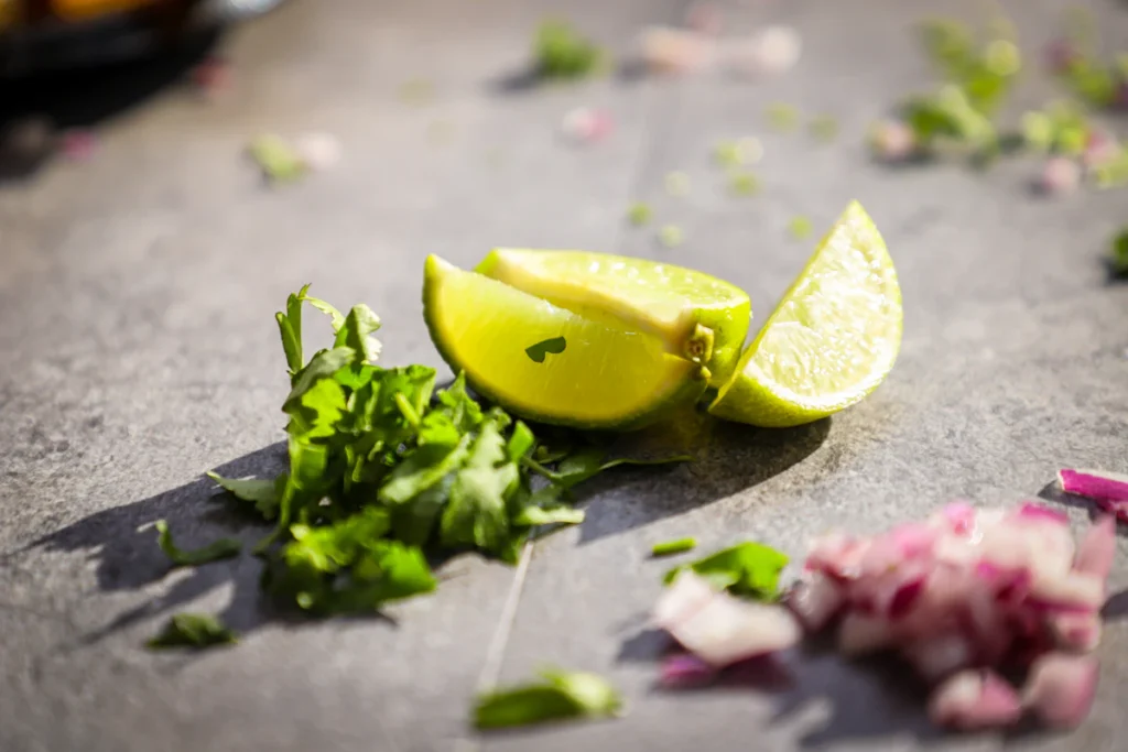 Fresh limes and cilantro for a lime cumin dressing
