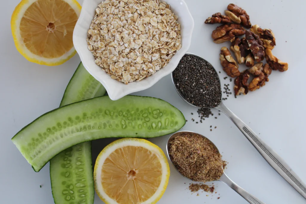 Overnight oats ingredients: rolled oats, chia seeds, and toppings in small bowls