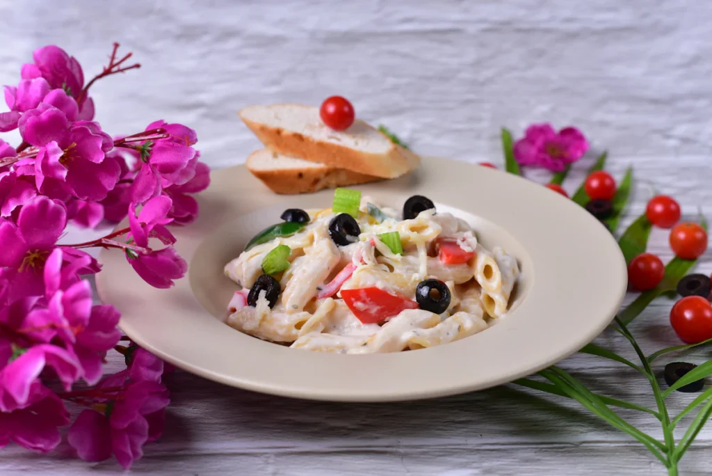 Pasta salad served on a plate for a picnic