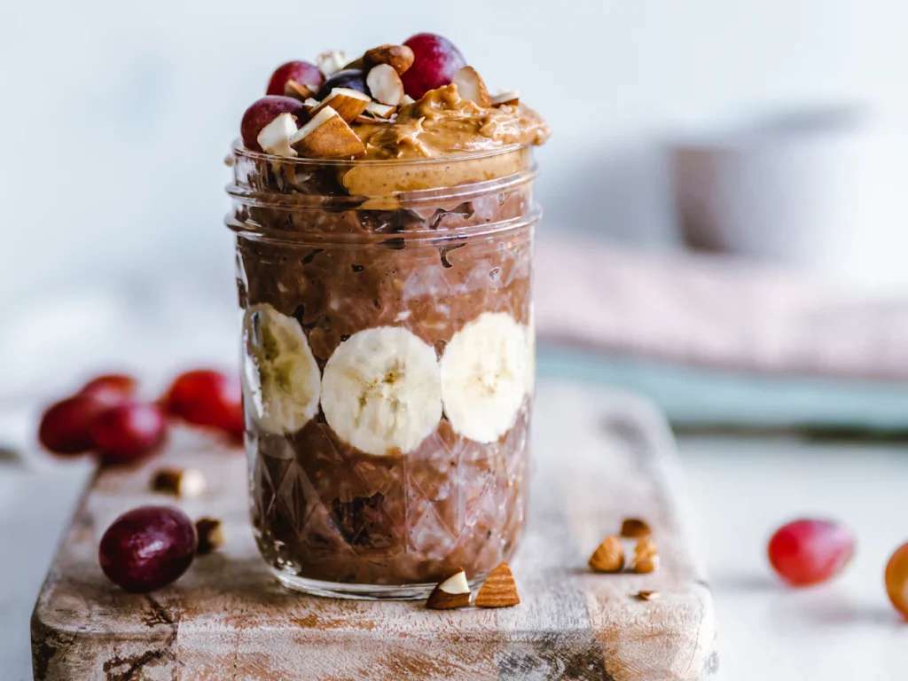 Chocolate peanut butter banana overnight oats in a glass jar