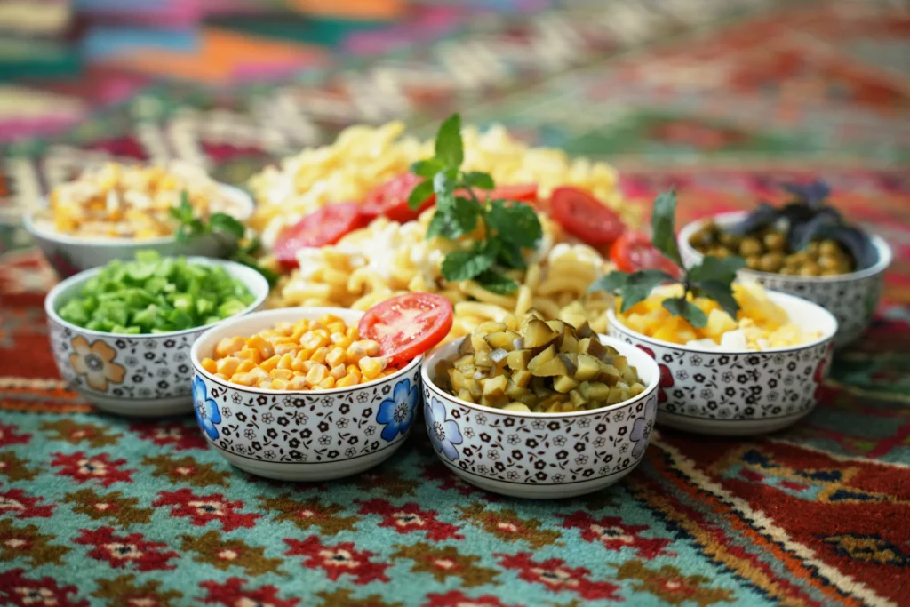 Small bowls of pickles and vegetables