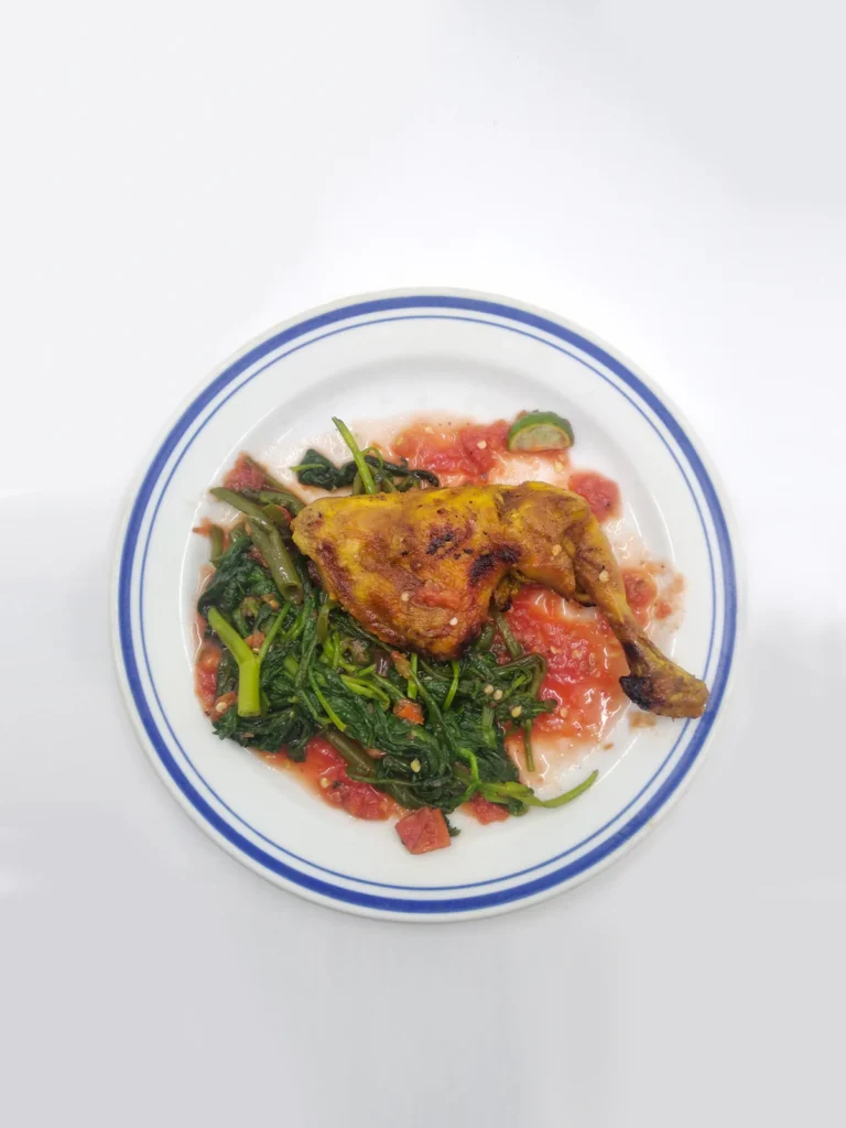 Chicken Provençal plated with greens