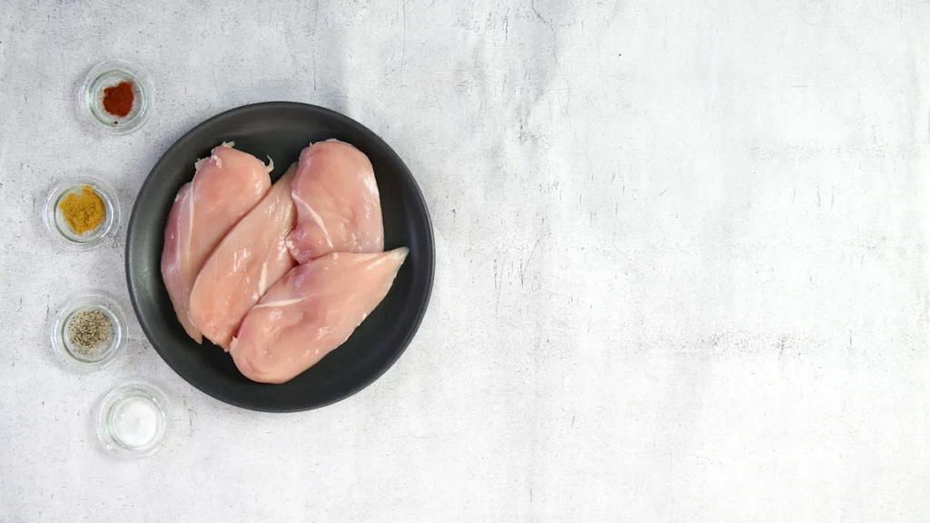 Raw chicken breasts ready for the slow cooker