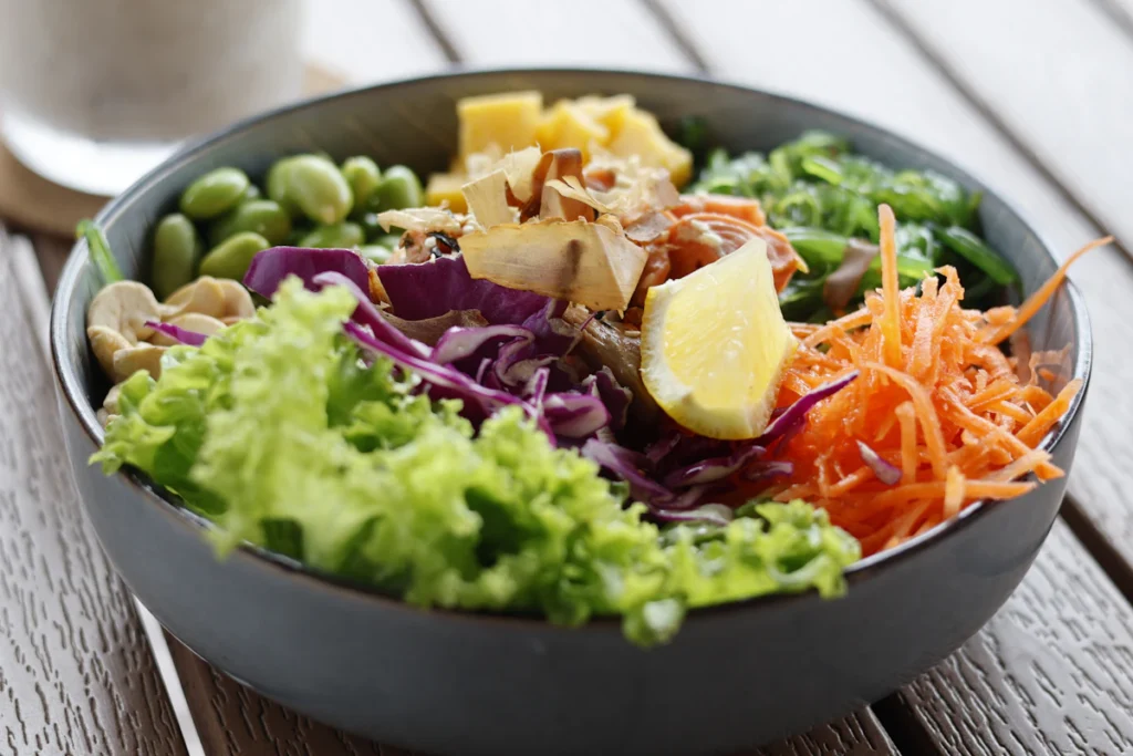 Poke-style bowl with salmon, vegetables, and rice