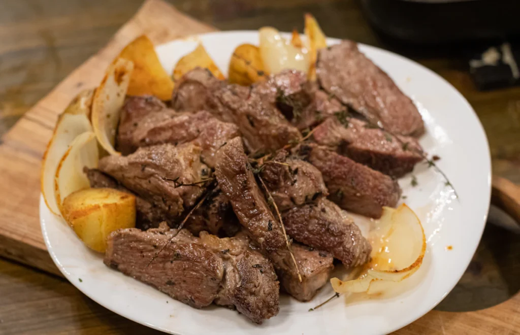 Juicy seared steak bites on a plate