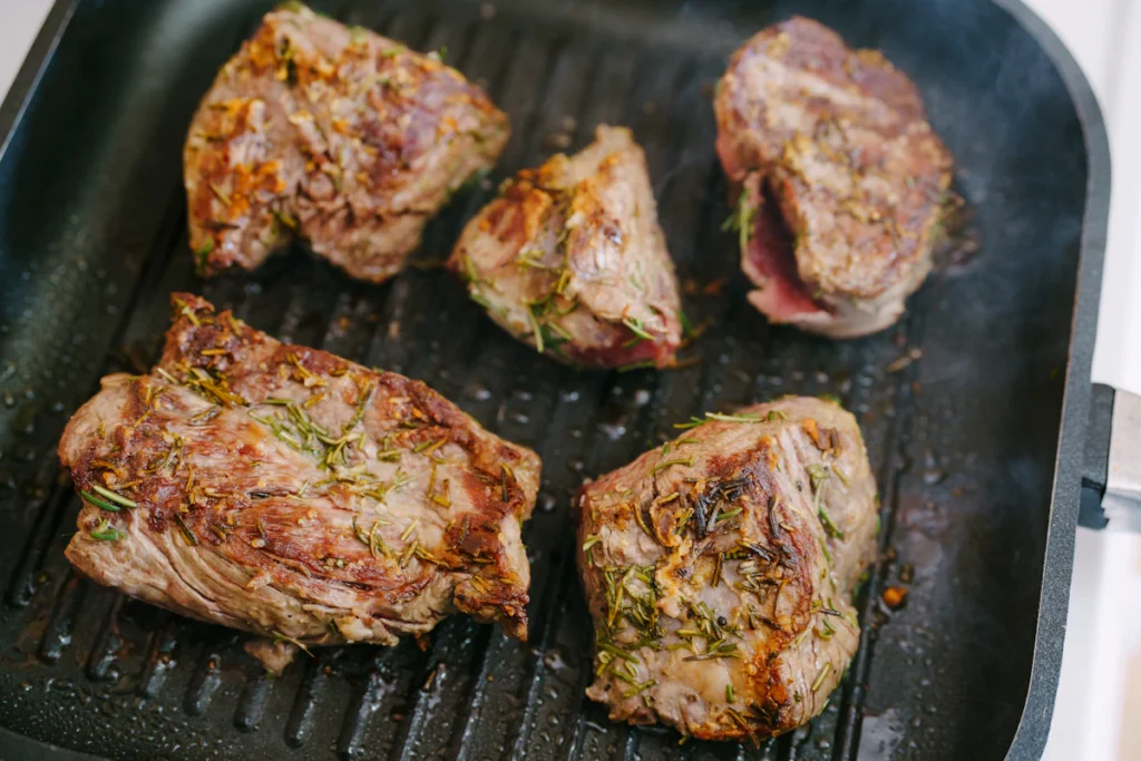 Searing steak in a hot pan