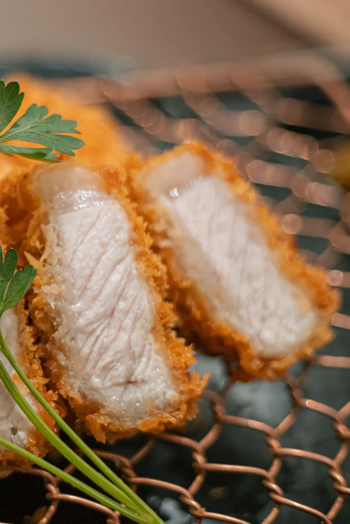 Sliced crispy breaded chicken cutlet