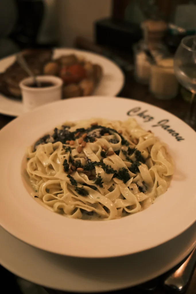 Creamy spinach pasta served with Parmesan