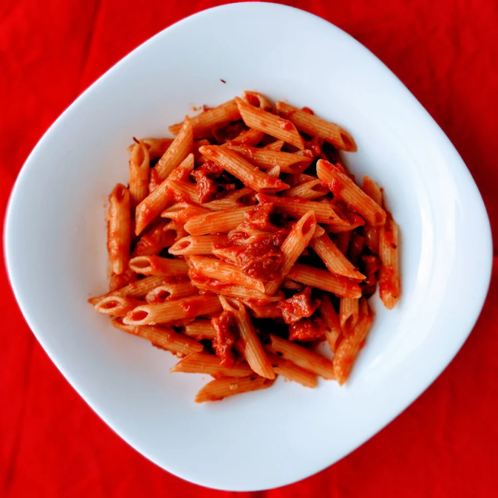 Pasta tossed in tomato sauce