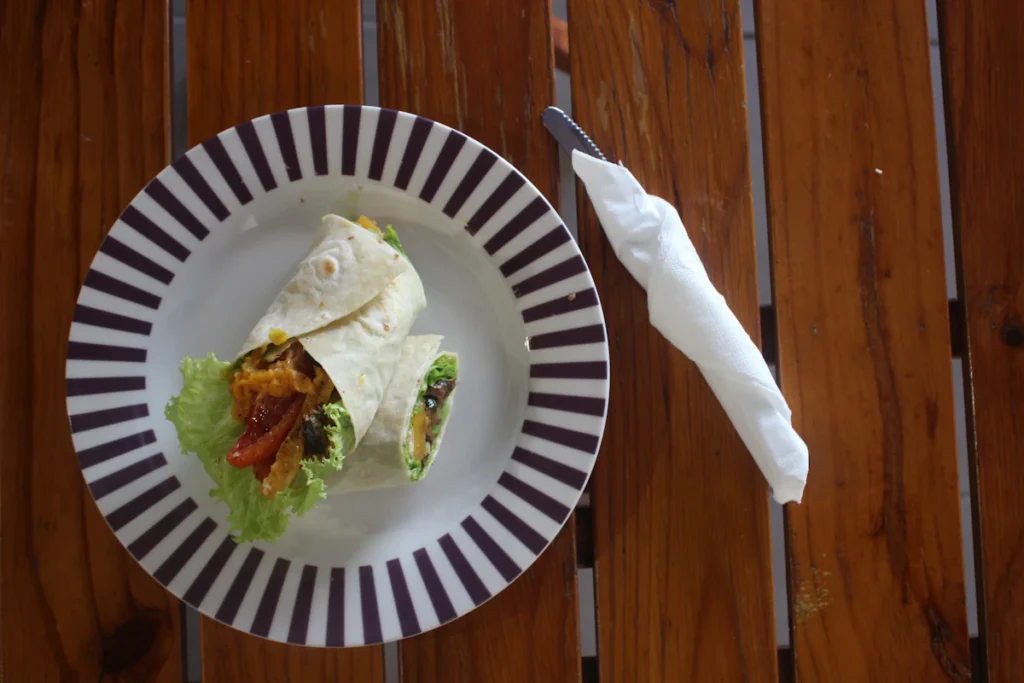 Two veggie wraps with lettuce on a plate