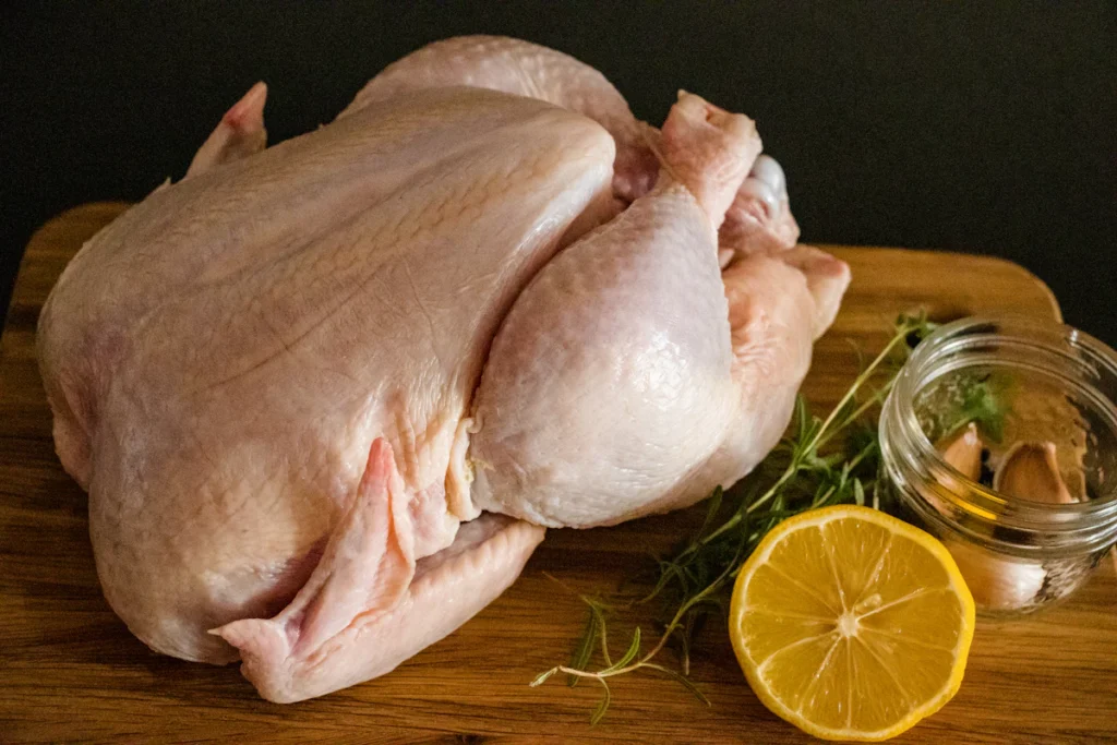 Whole raw chicken ready for boiling