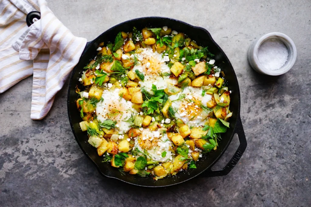 Skillet of zucchini and cheese ready to serve