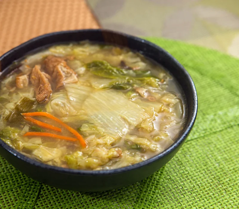 Bowl of cabbage soup for weight loss with vegetables in a savory tomato broth