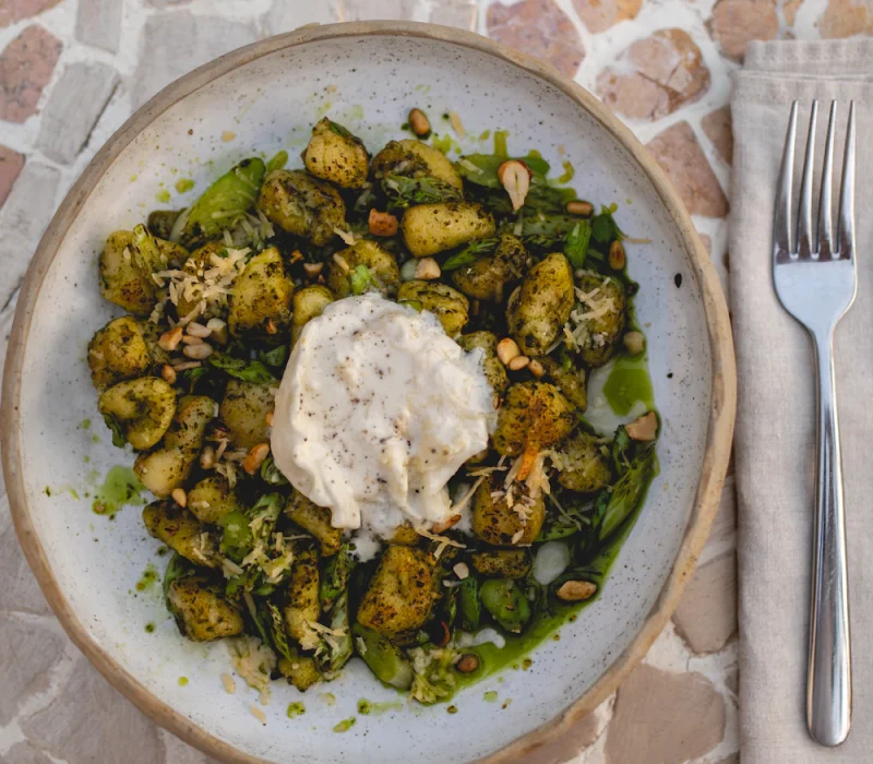 Creamy pesto gnocchi in a bowl